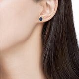 0.20 Ct. Tw. Diamond Around 1.20 Ct. Tw. Oval Sapphire Stud 14K Gold Earring